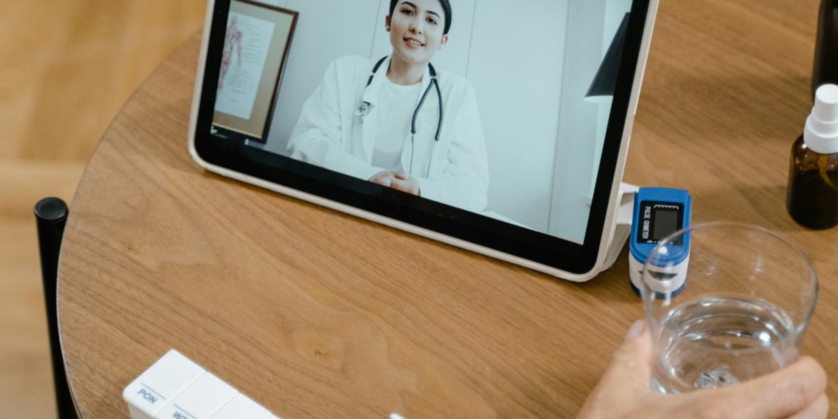 A person using a digital device to comfortably make a medical payment online, representing modern payment solutions.