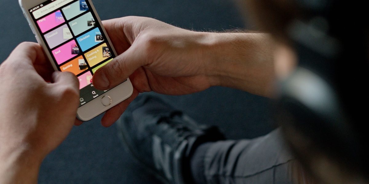 A person using a mobile app to manage their health, reflecting improved patient access and engagement through digital channels.