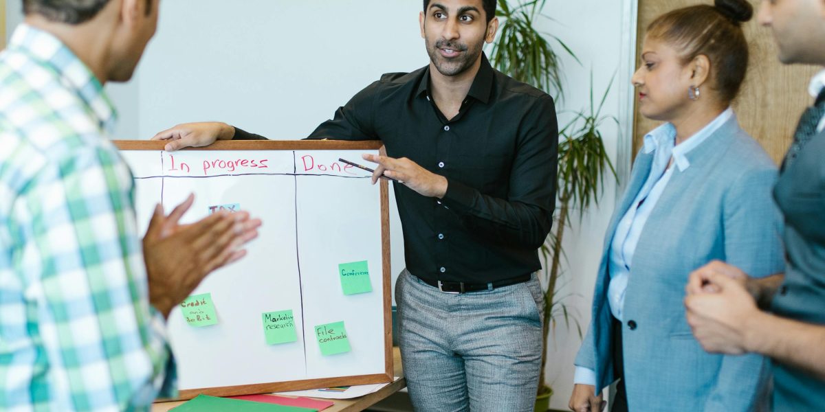 A team collaborates to discuss and select optimal employee benefits packages for their workforce.