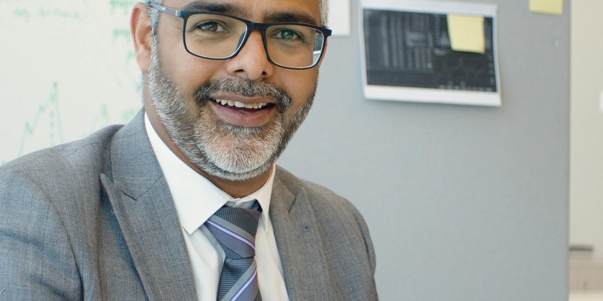 A health tech leader confidently leads their team, having made informed decisions about employee well-being.