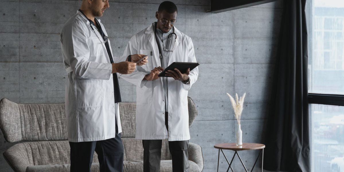 A diverse healthcare team collaborating and sharing information seamlessly, enabled by effective interoperability.