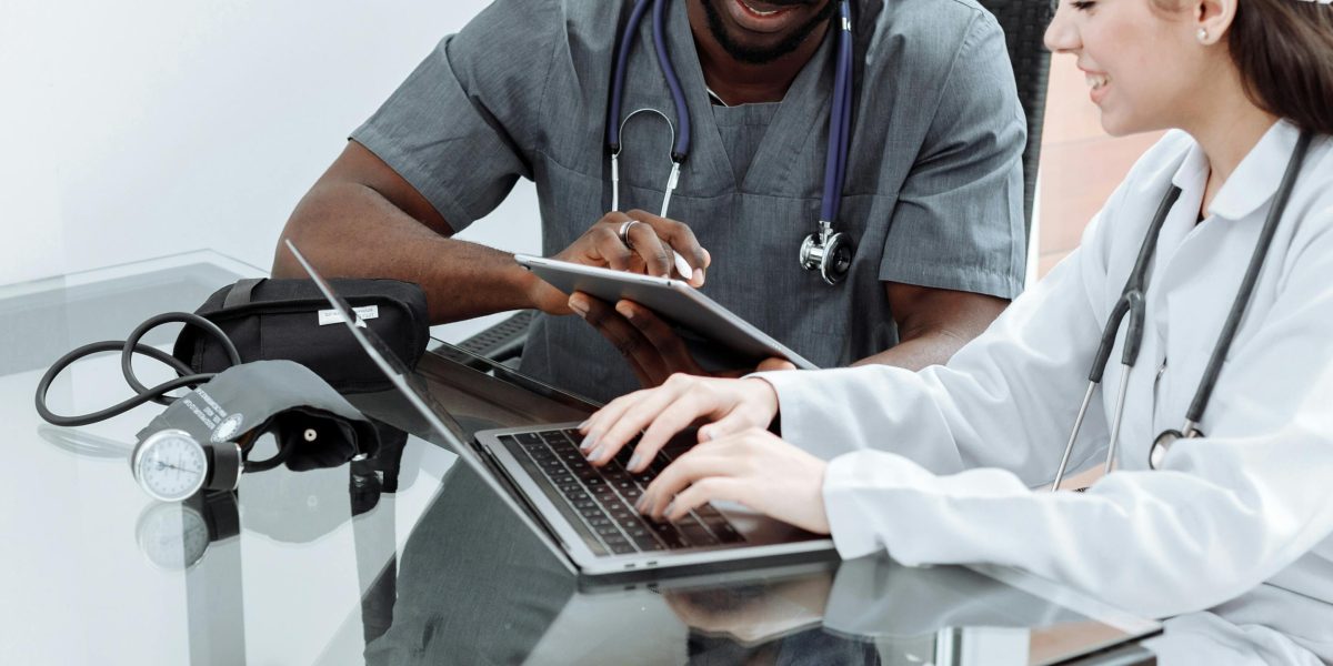 Healthcare professionals actively participating in a training session to learn and adopt new digital health tools.