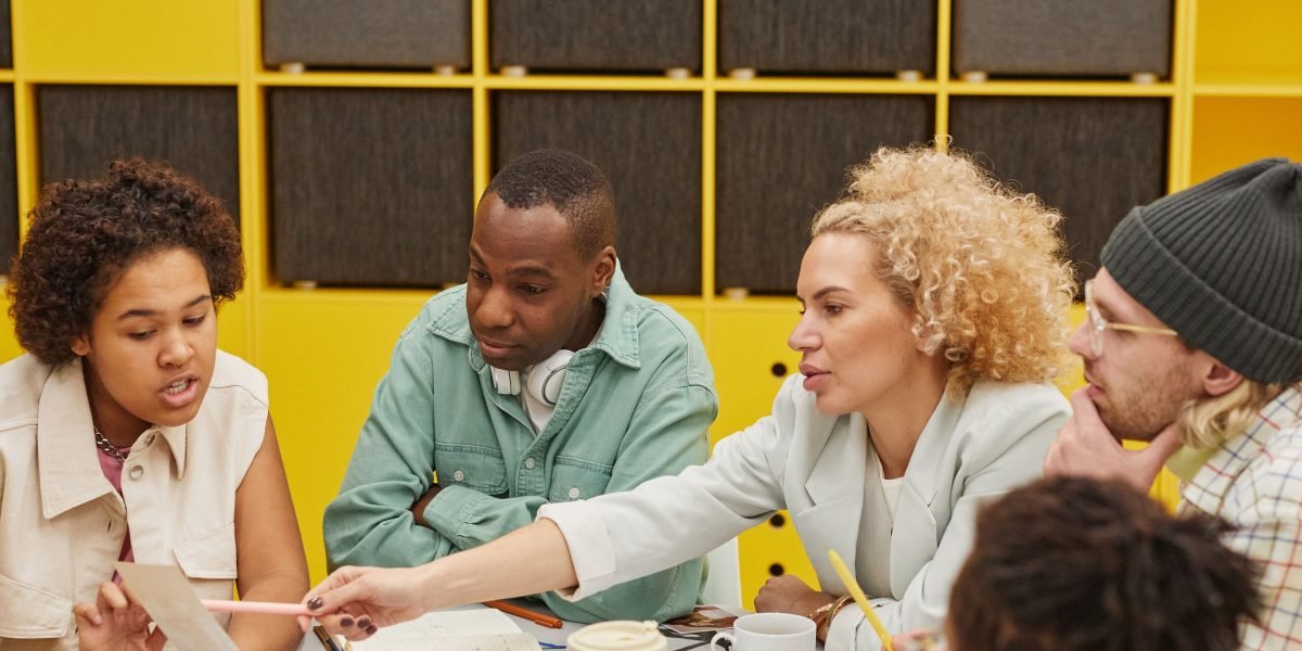 A diverse team actively brainstorming innovative solutions for modern digital platforms.