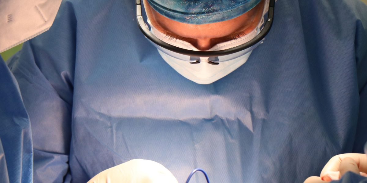 A medical team intently focused while responding to a critical patient emergency, highlighting rapid decision-making.