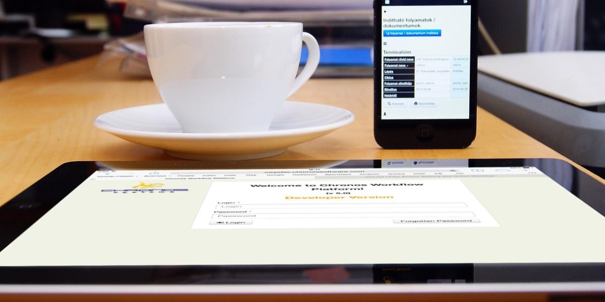 Clinicians actively discussing and adapting to new digital workflows in a healthcare setting.