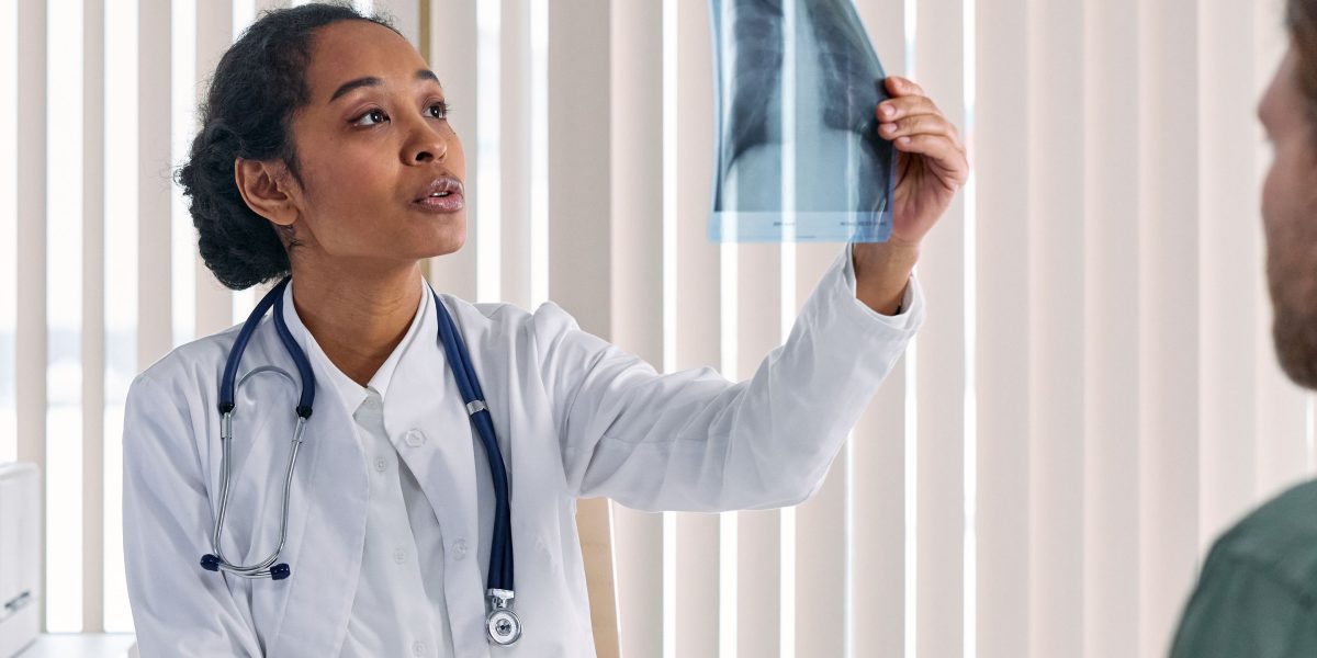 A healthcare professional discusses treatment options and wellness goals with a patient, emphasizing collaborative care.