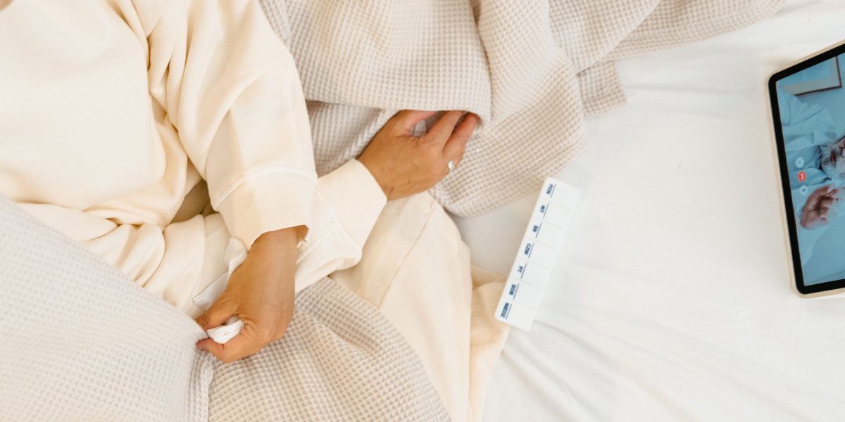 A person engaging in a telehealth consultation from home, demonstrating the use of digital health tools.