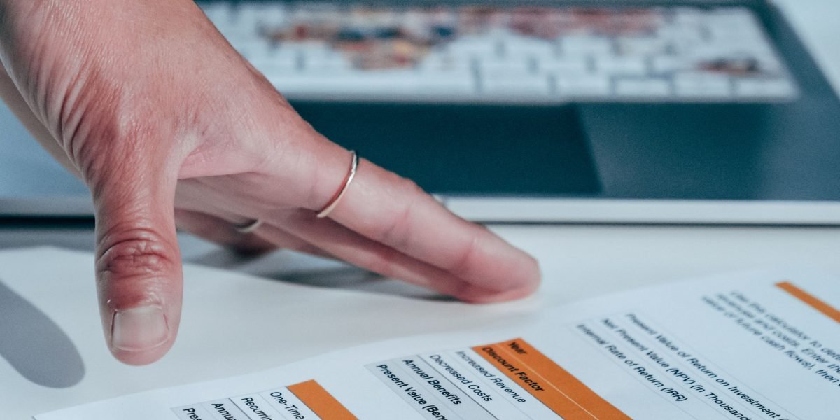 A professional reviews performance metrics on a dashboard, essential for measuring the success of new healthcare technologies.