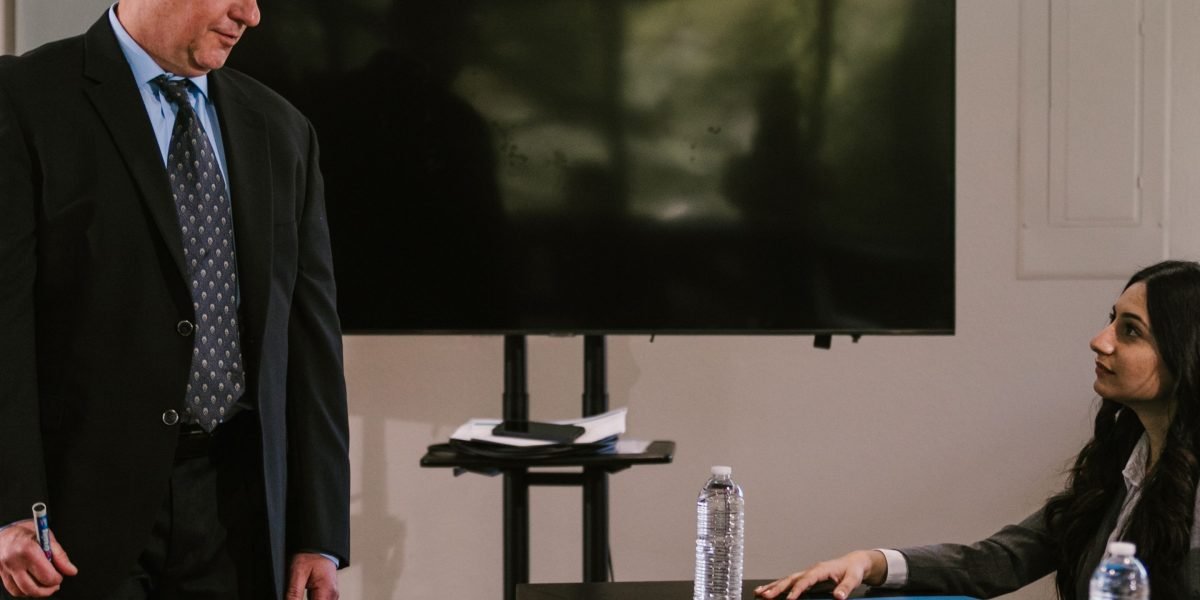 A professional looking confident while discussing important business decisions, symbolizing the strategic importance of private health insurance.