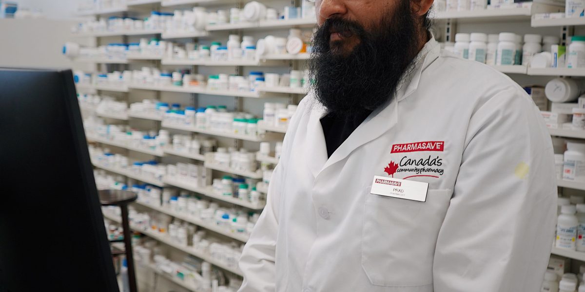 A pharmacist carefully reviewing a medication label, illustrating diligence in preventing errors from unclear prescriptions.
