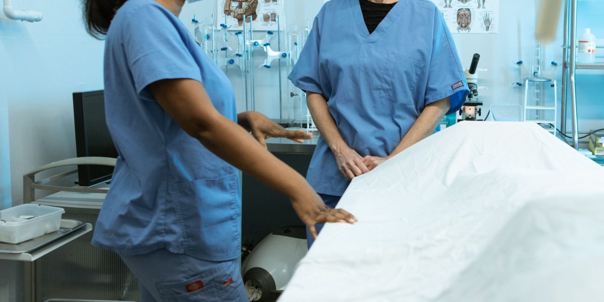 Healthcare professionals participating in a training session, focused on adopting new policies and technologies for patient safety.