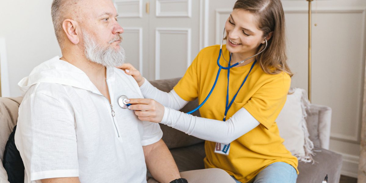 A caregiver attentively listening to a patient, fostering trust and a strong personal connection in a healthcare setting.