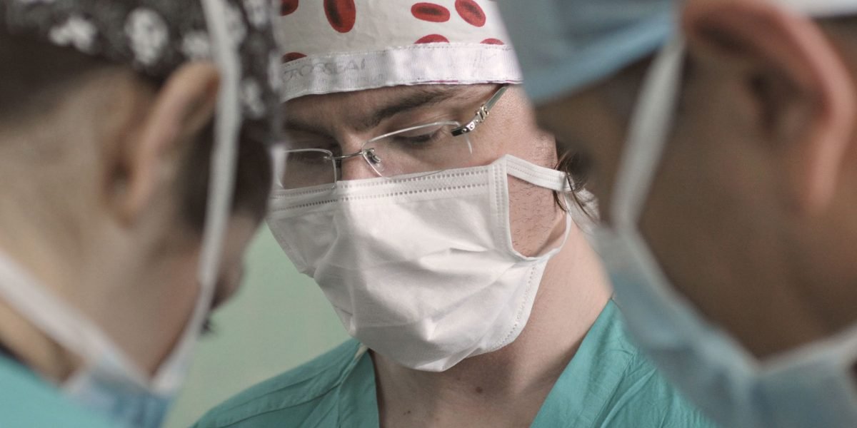 A diverse medical team collaborating in a modern healthcare setting, symbolizing AI's integration.