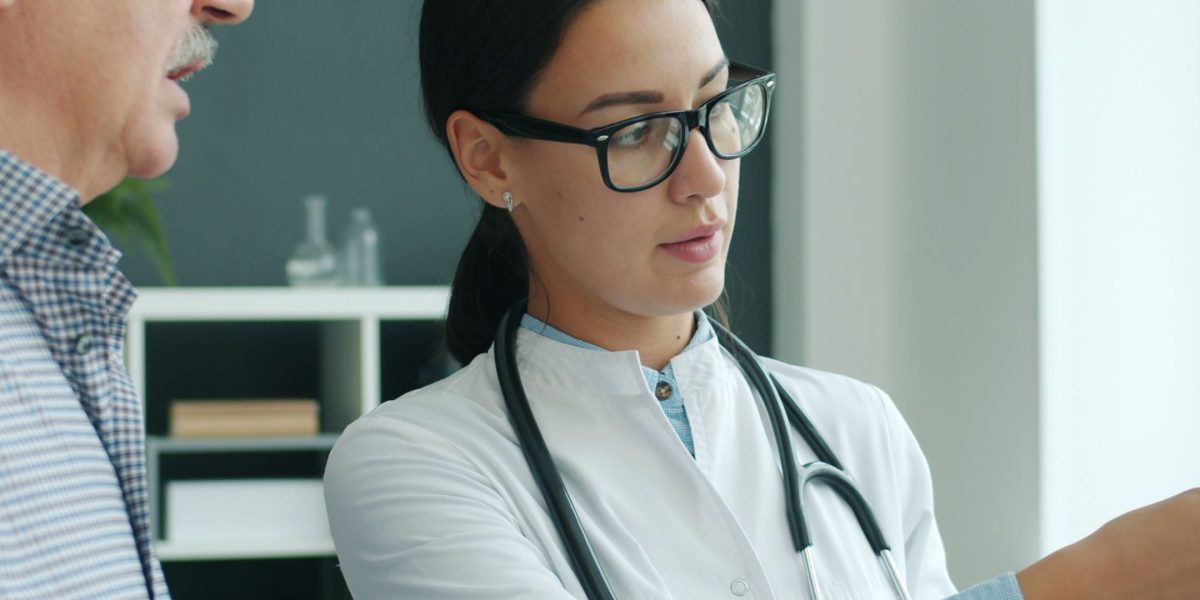 A doctor clearly explaining test results to a patient, fostering understanding and trust in healthcare.